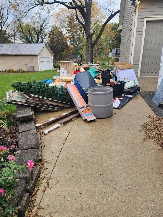 Dumpster being loaded with debris for 3 Yard Dumpster Rental in St. Charles
